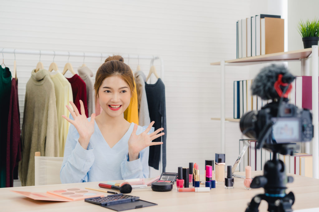 beauty-blogger-present-beauty-cosmetics-sitting-front-camera-recording-video-for-tiktok-marketing